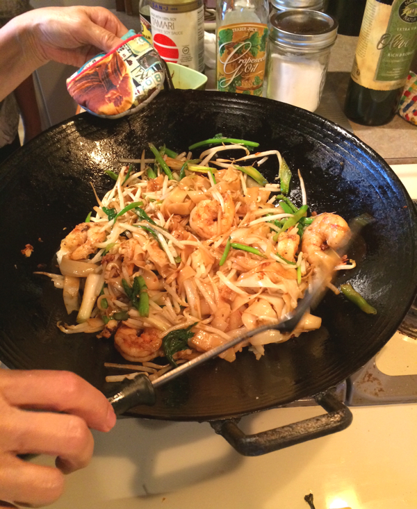 6. Add in bean sprouts, shrimp to noodles and combine. This is when you taste and add your dark soy and little salt so it's not too dark. Test for spiciness. Push your noodles to one side and fry some chilies in wok first before recombining. 